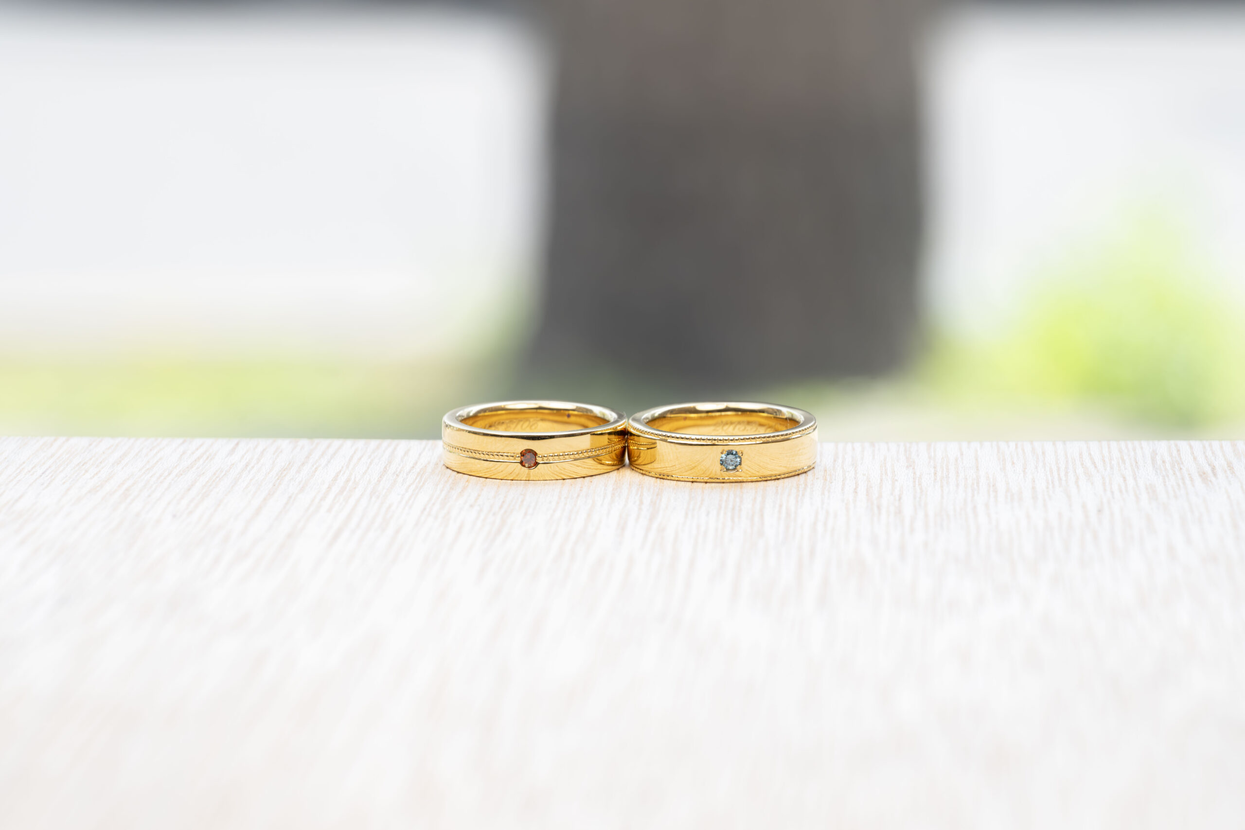 ペアリング（彫金工法）ブルートパーズルビーななこ留め伏込み留めカラーコーティングミル打ち鏡面