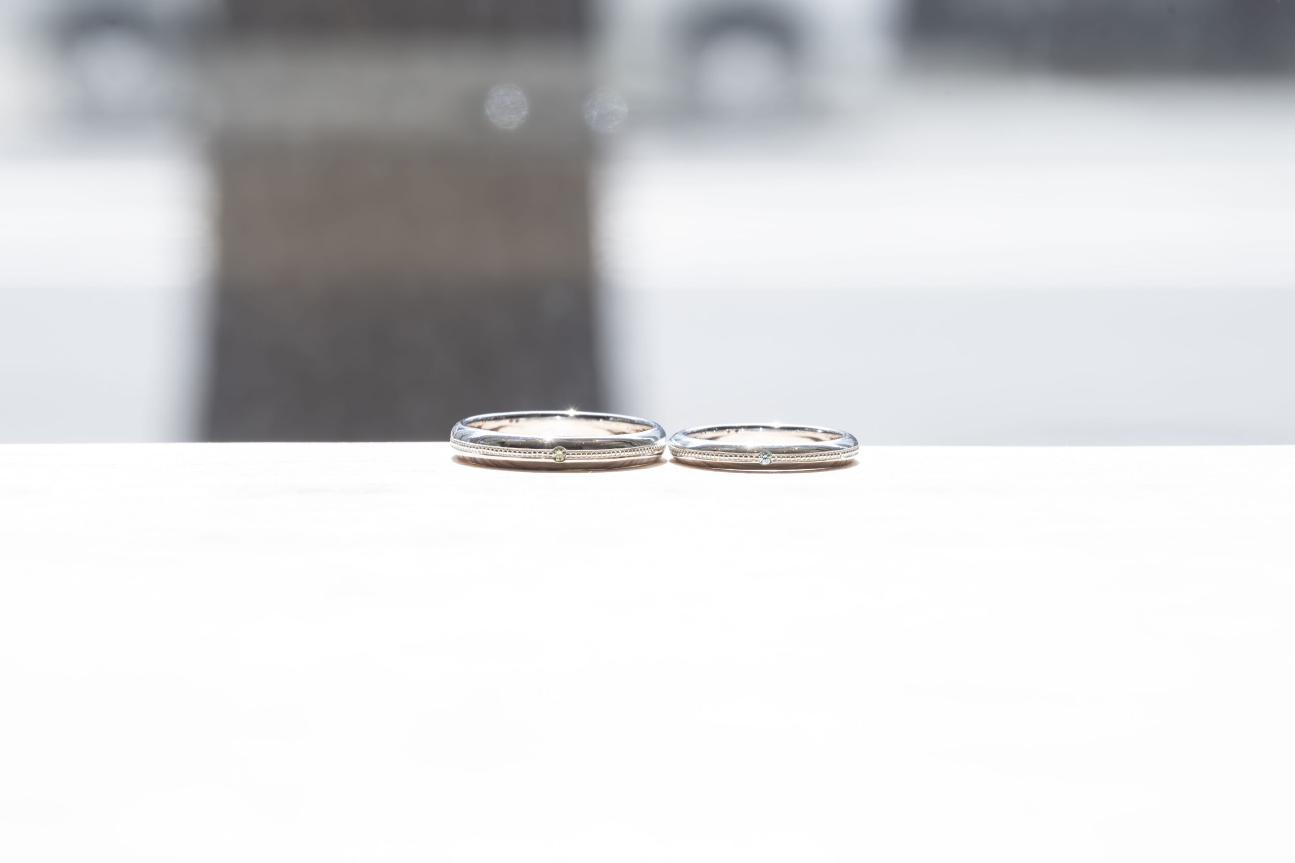 ペアリング（彫金工法）ブルートパーズペリドット伏込み留めミル打ち鏡面